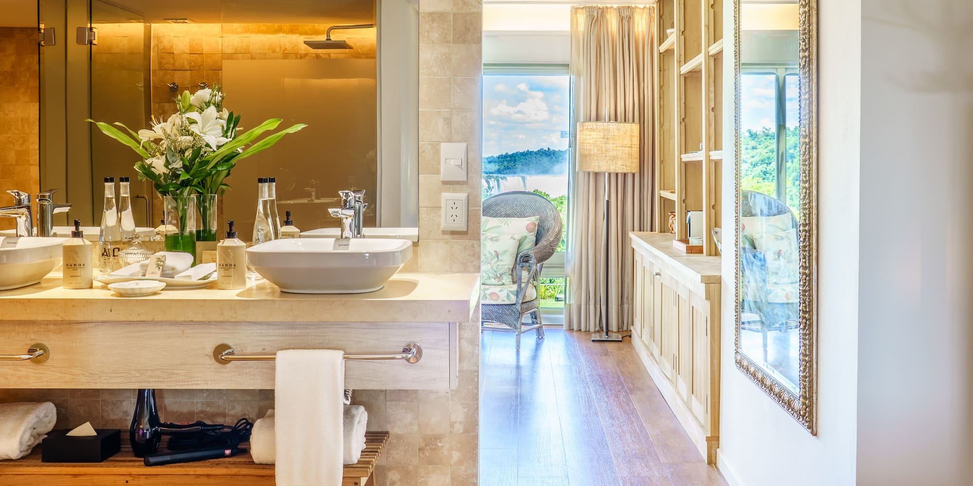 a bathroom with a tub and a large mirror
