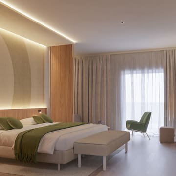 a bedroom with a bed and a chair