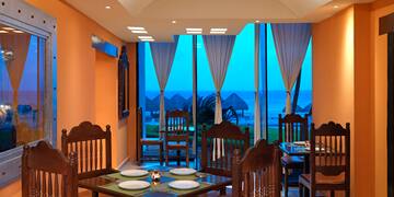 a room with a table and chairs