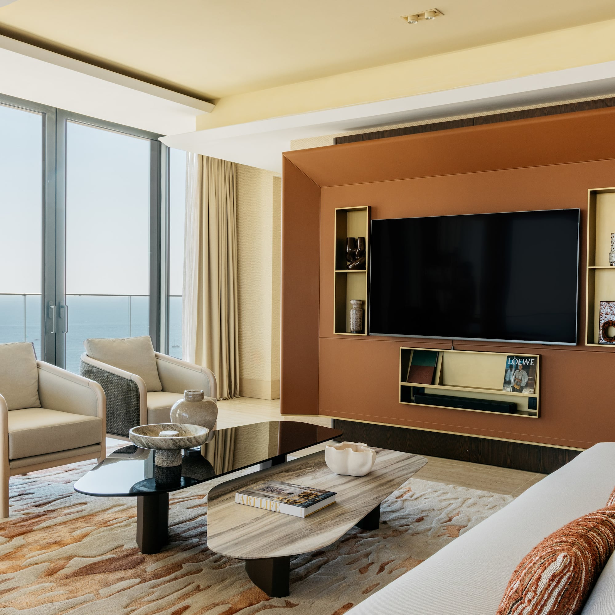 a living room with a large television and a large wall