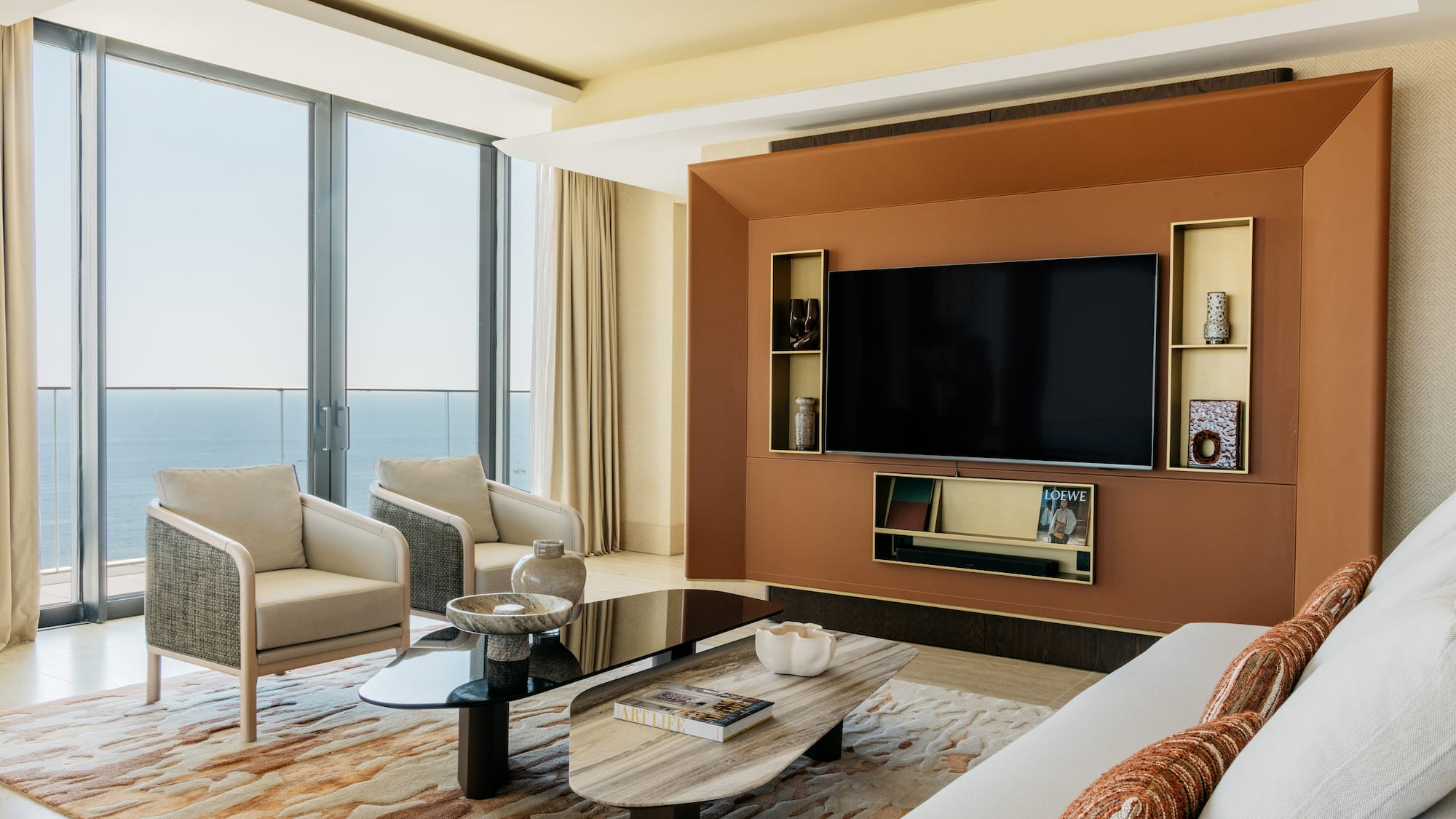 a living room with a large television and a large wall