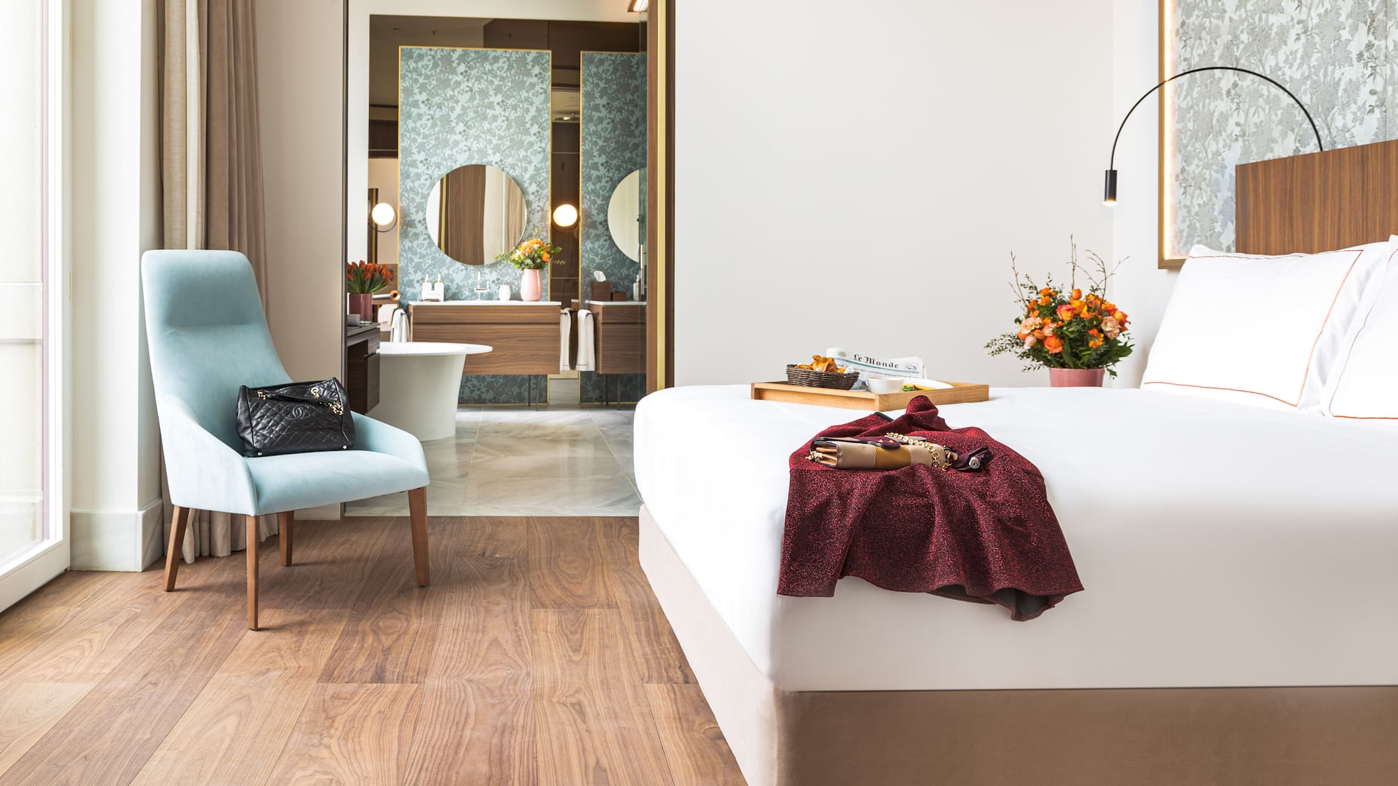 a room with a bed and chair