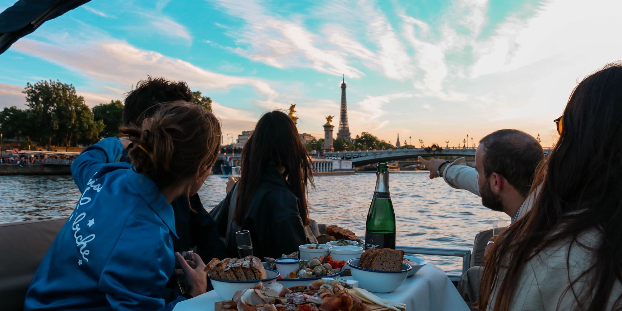 a group of people eating on a boat