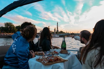 a group of people eating on a boat