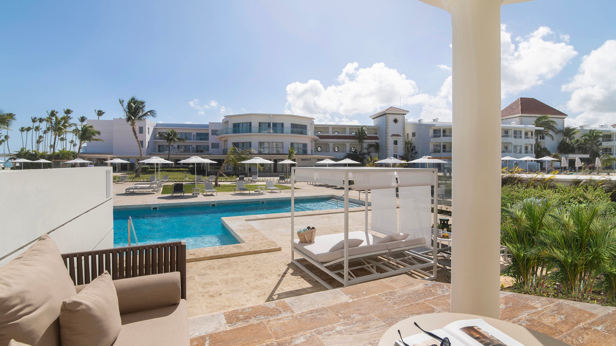 a pool with a couch and a chair