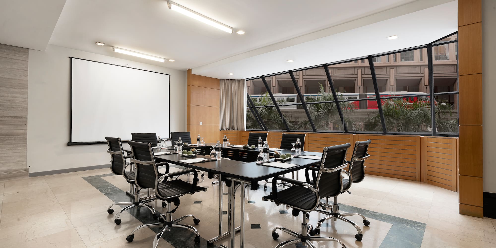 a conference room with a table and chairs