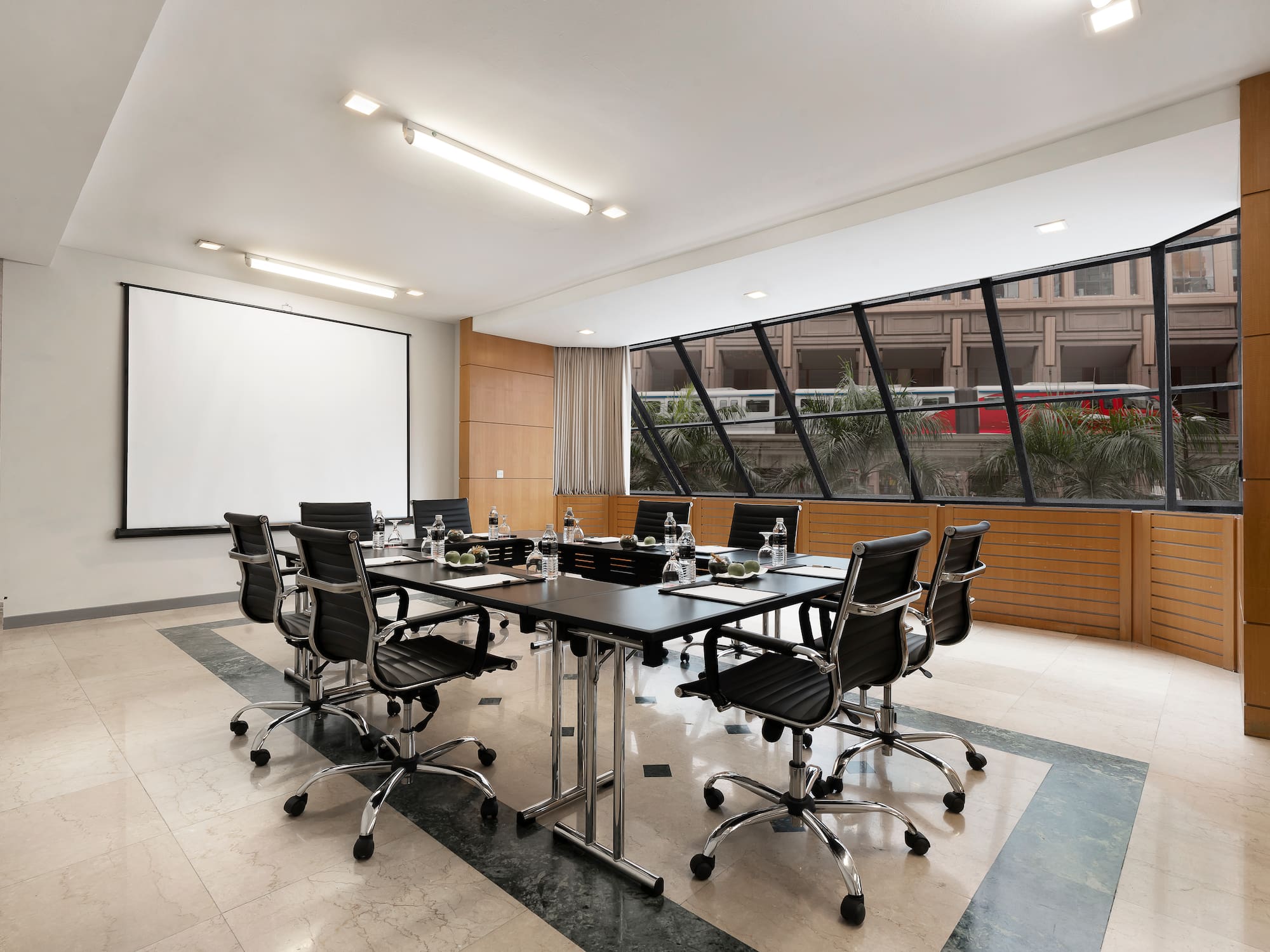 a conference room with a table and chairs