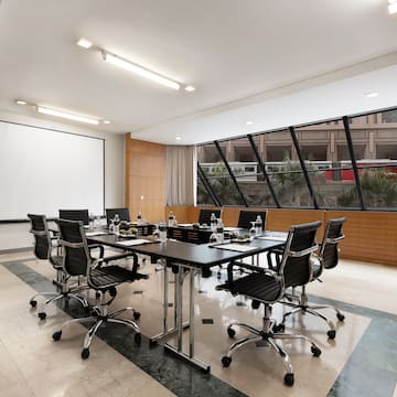 a conference room with a table and chairs