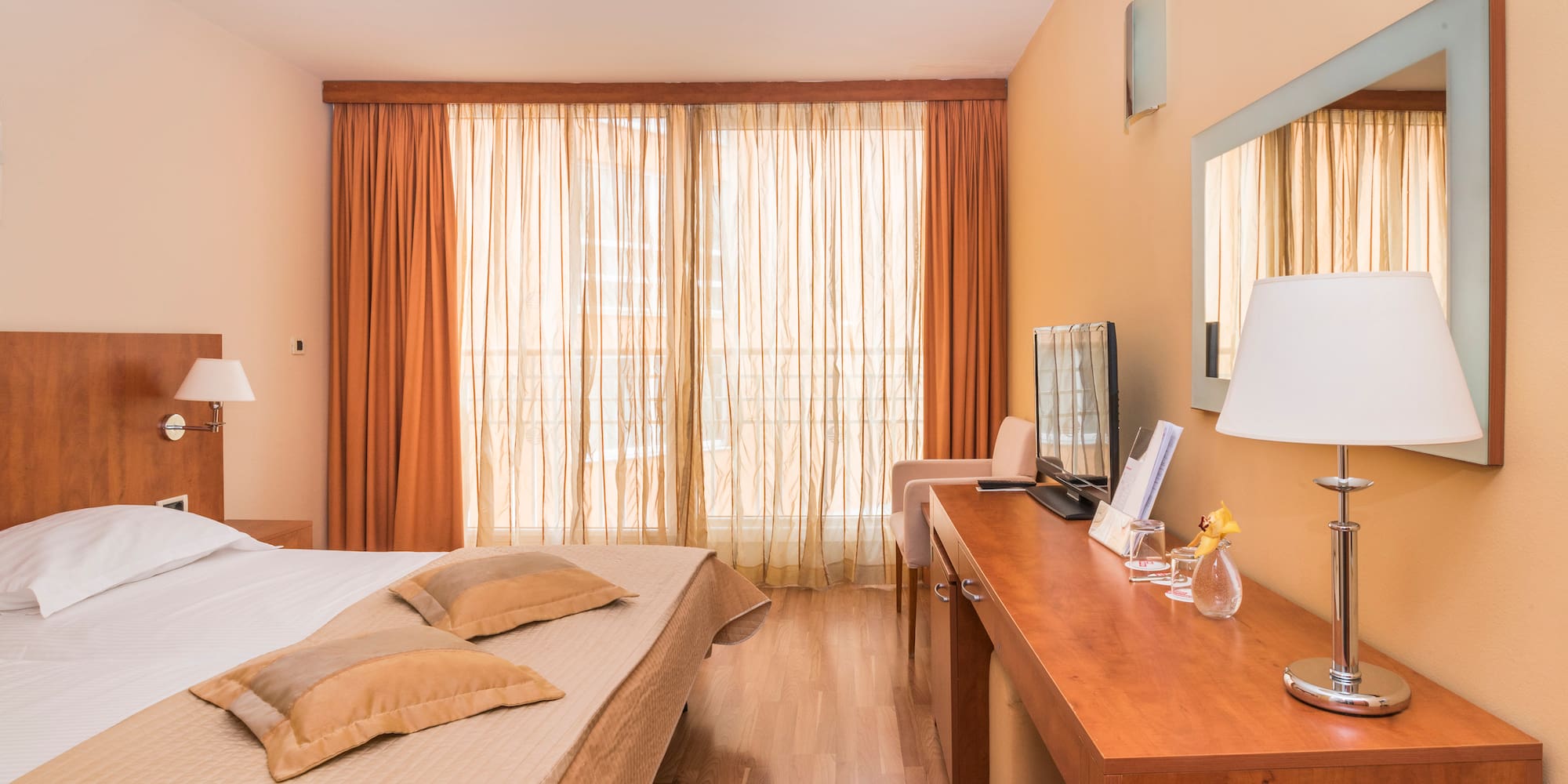 a room with a bed and a desk