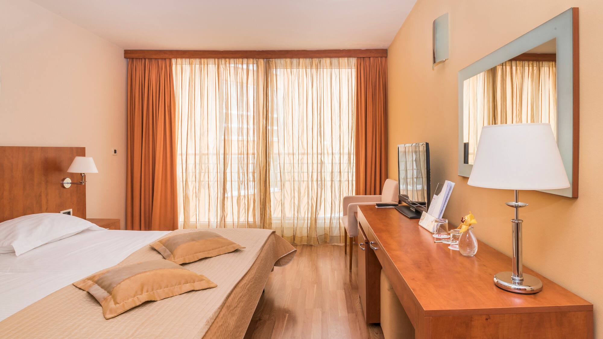 a room with a bed and a desk