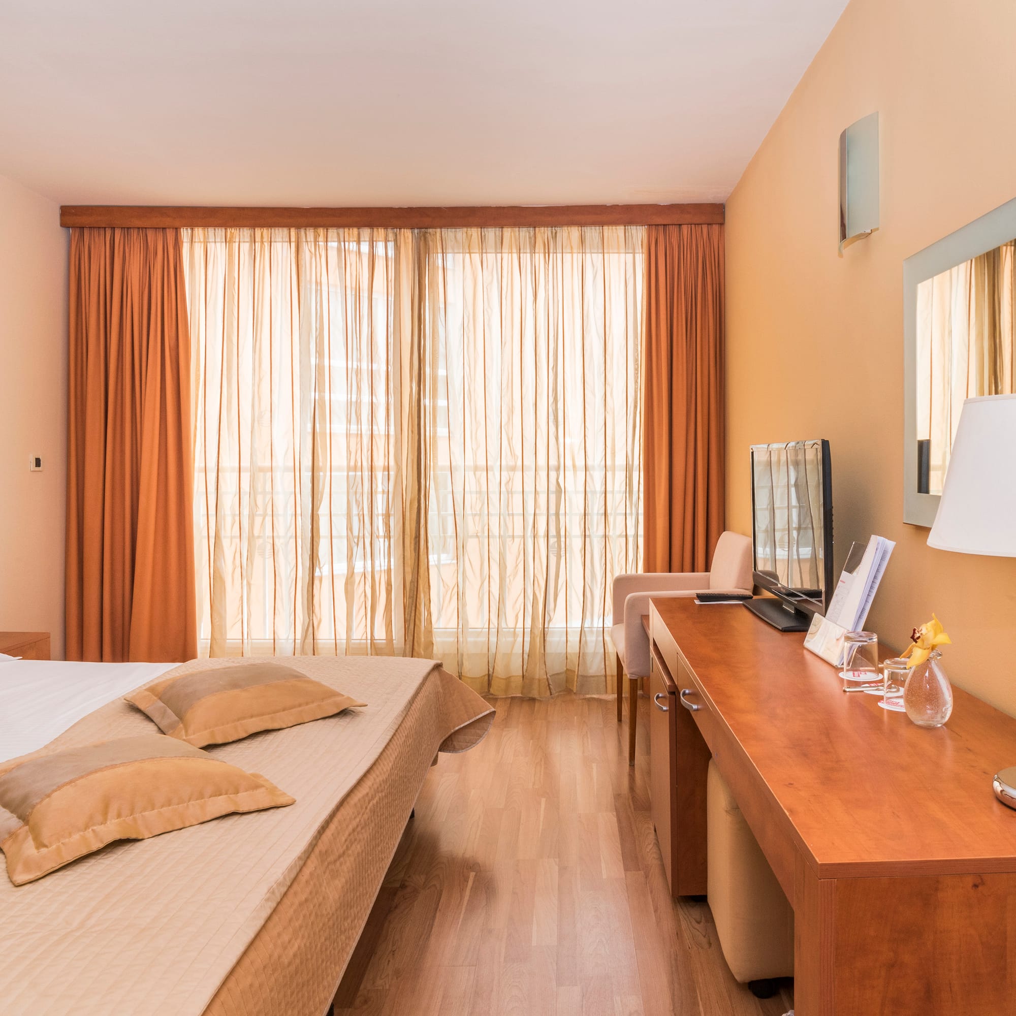 a room with a bed and a desk