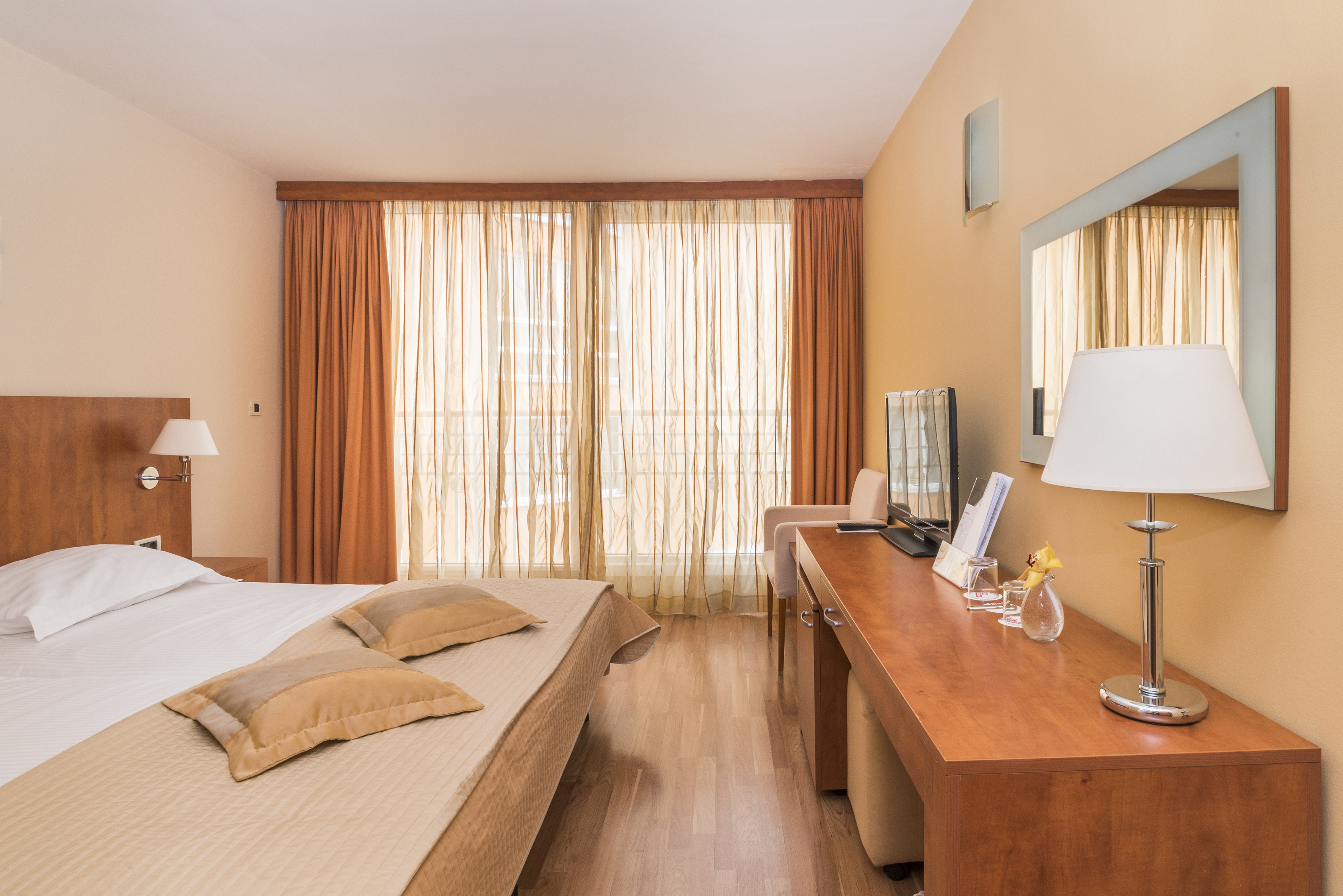 a room with a bed and a desk