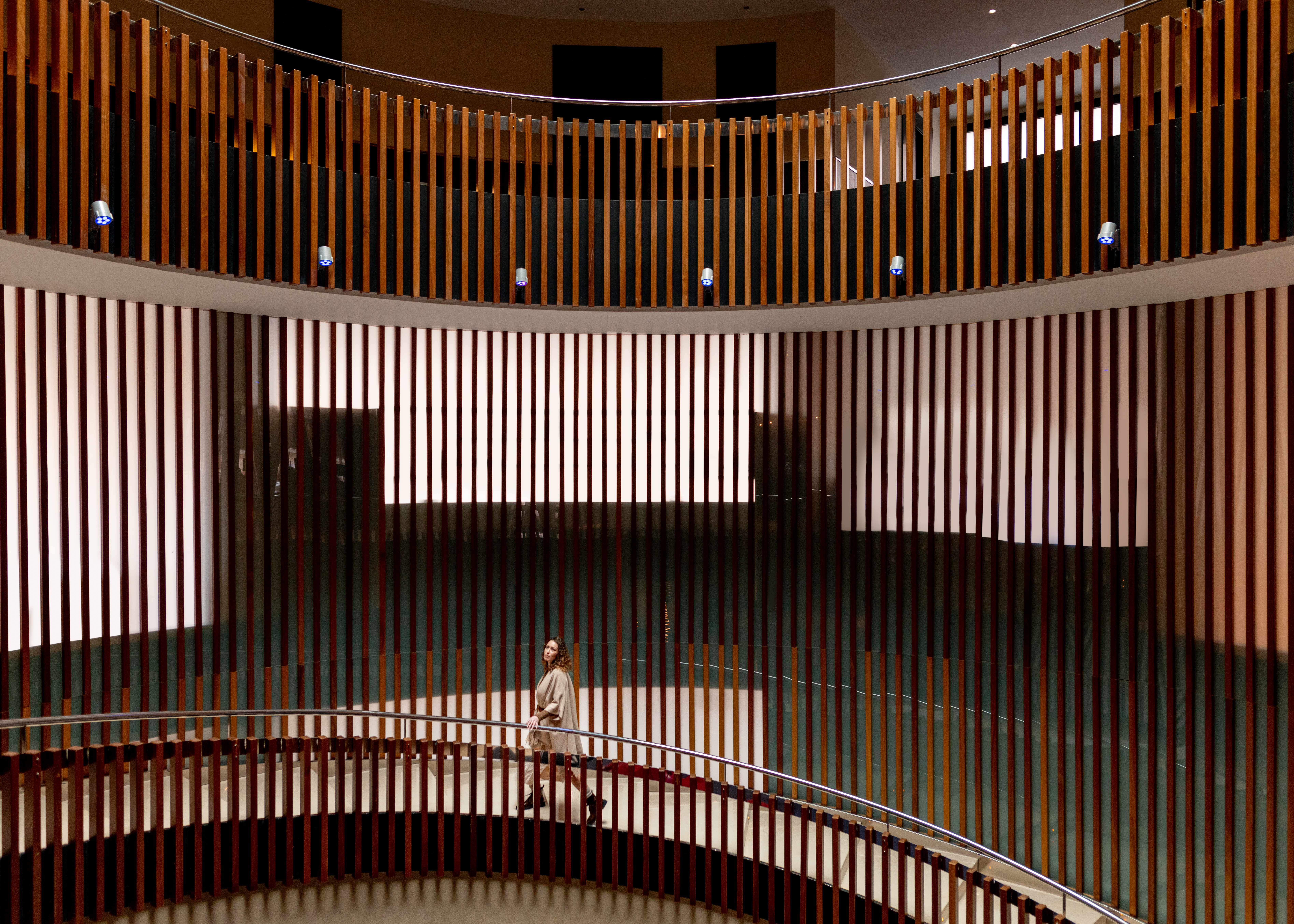 a person standing on a round staircase