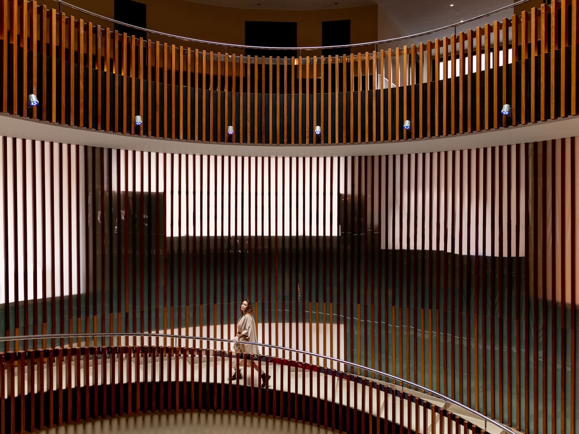 a person standing on a round staircase