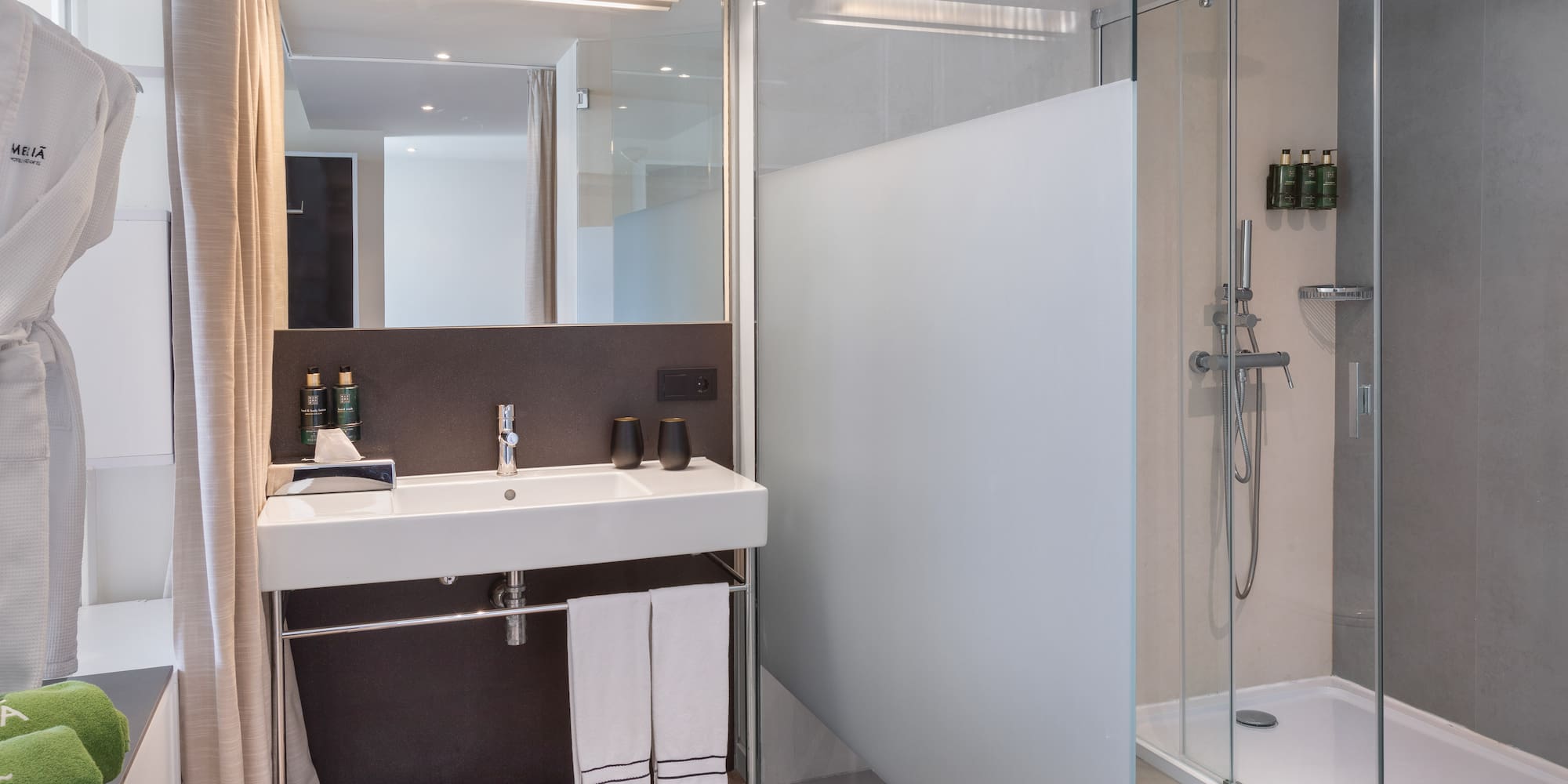 a bathroom with a shower and sink