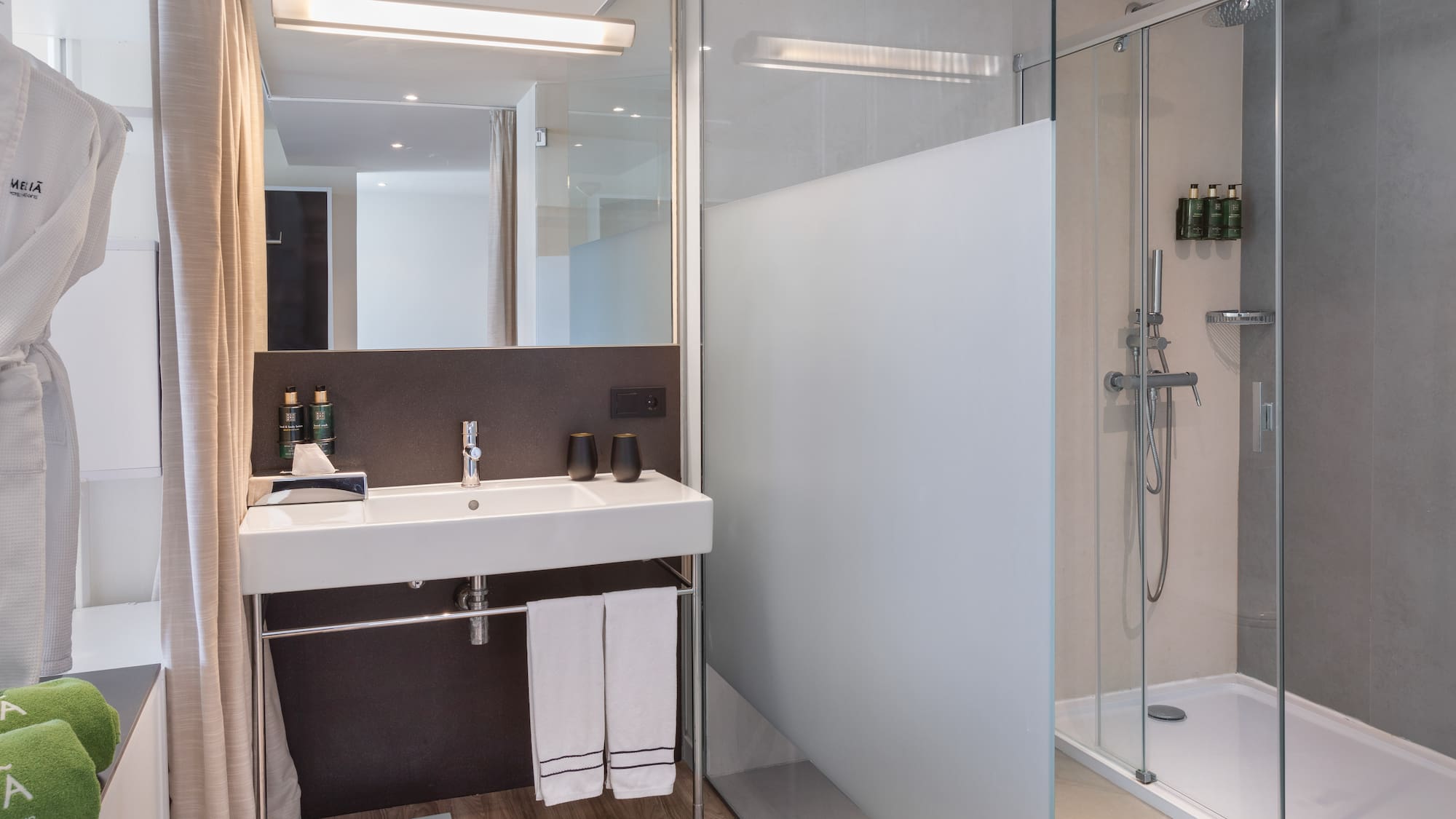 a bathroom with a shower and sink