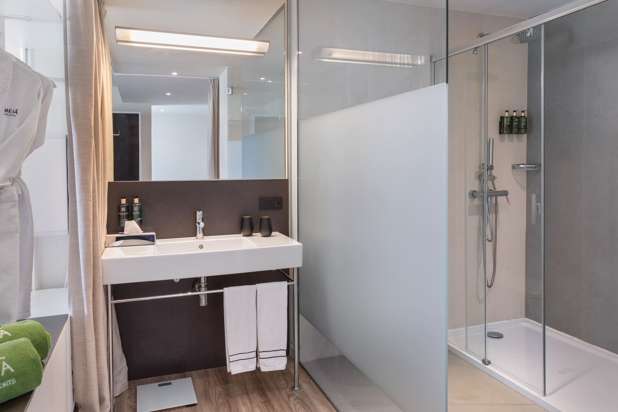 a bathroom with a shower and sink