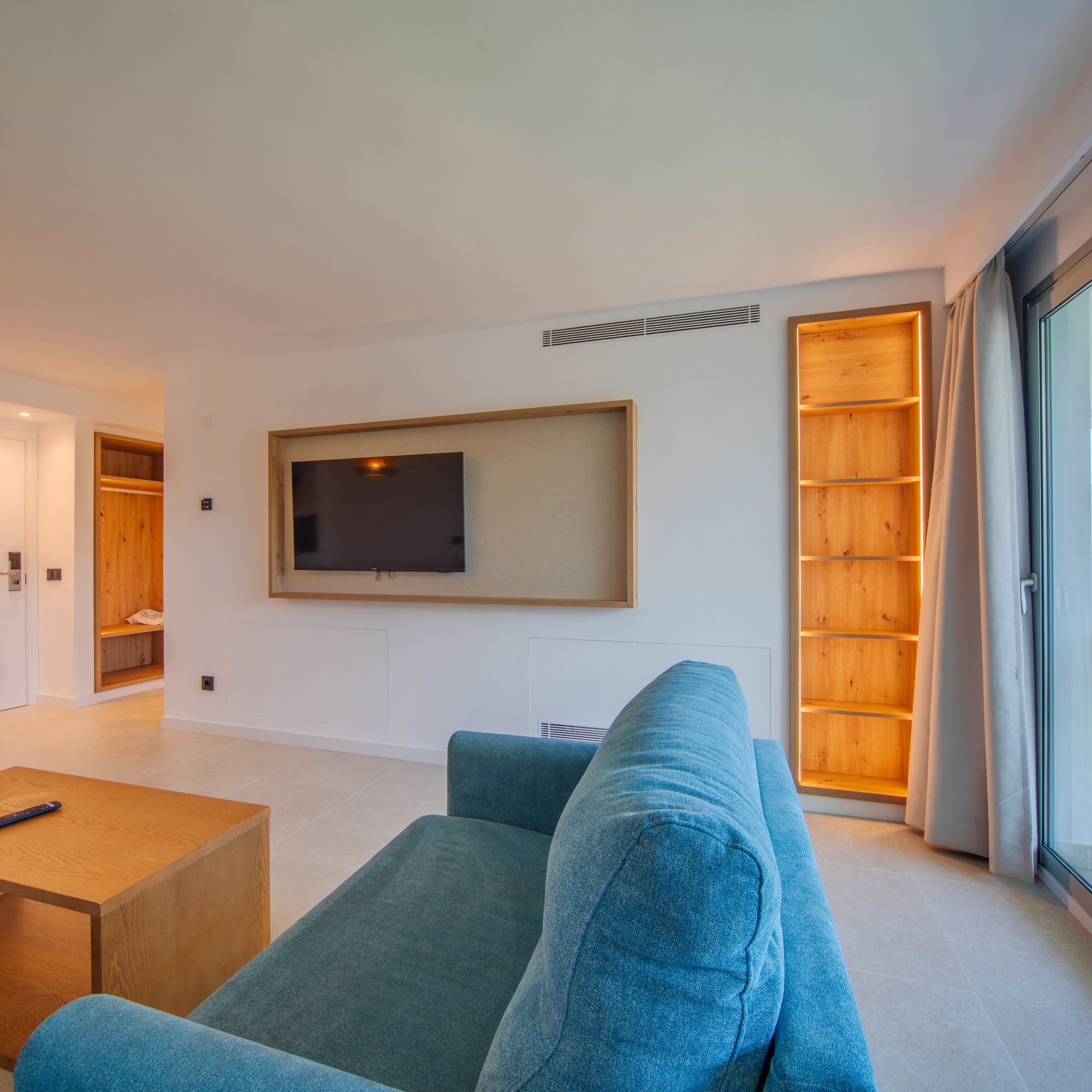 a living room with a couch and a tv