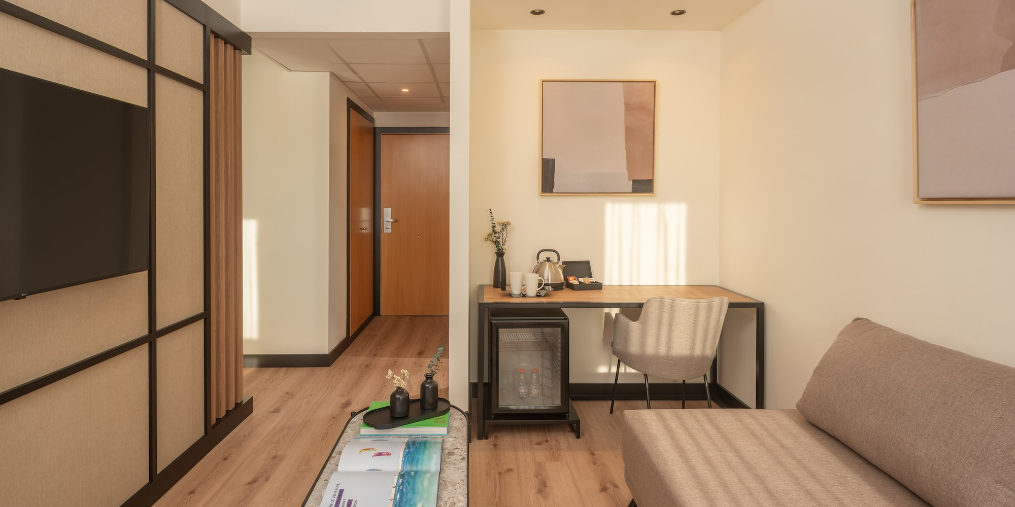 a room with a couch and a desk