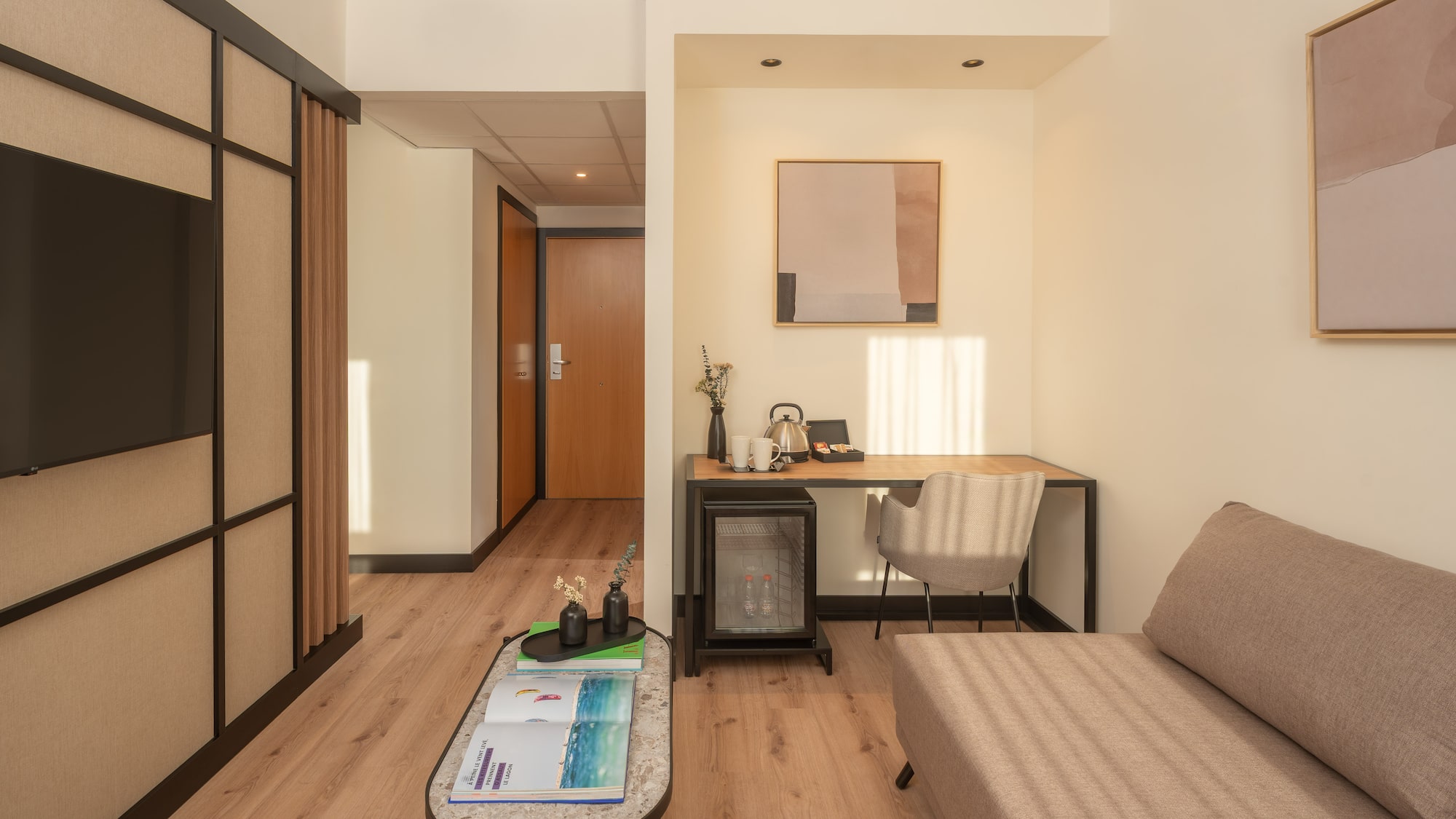 a room with a couch and a desk