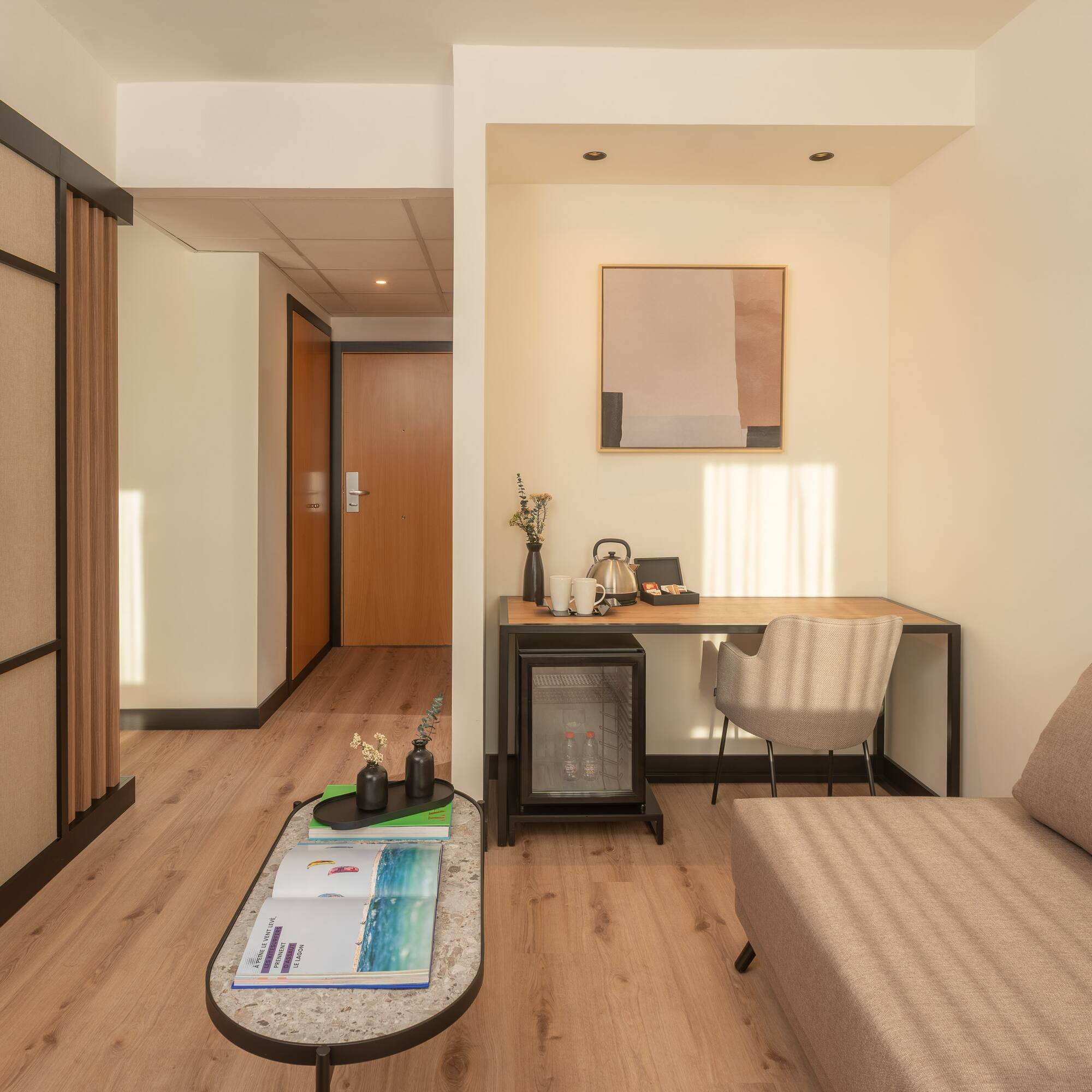 a room with a couch and a desk