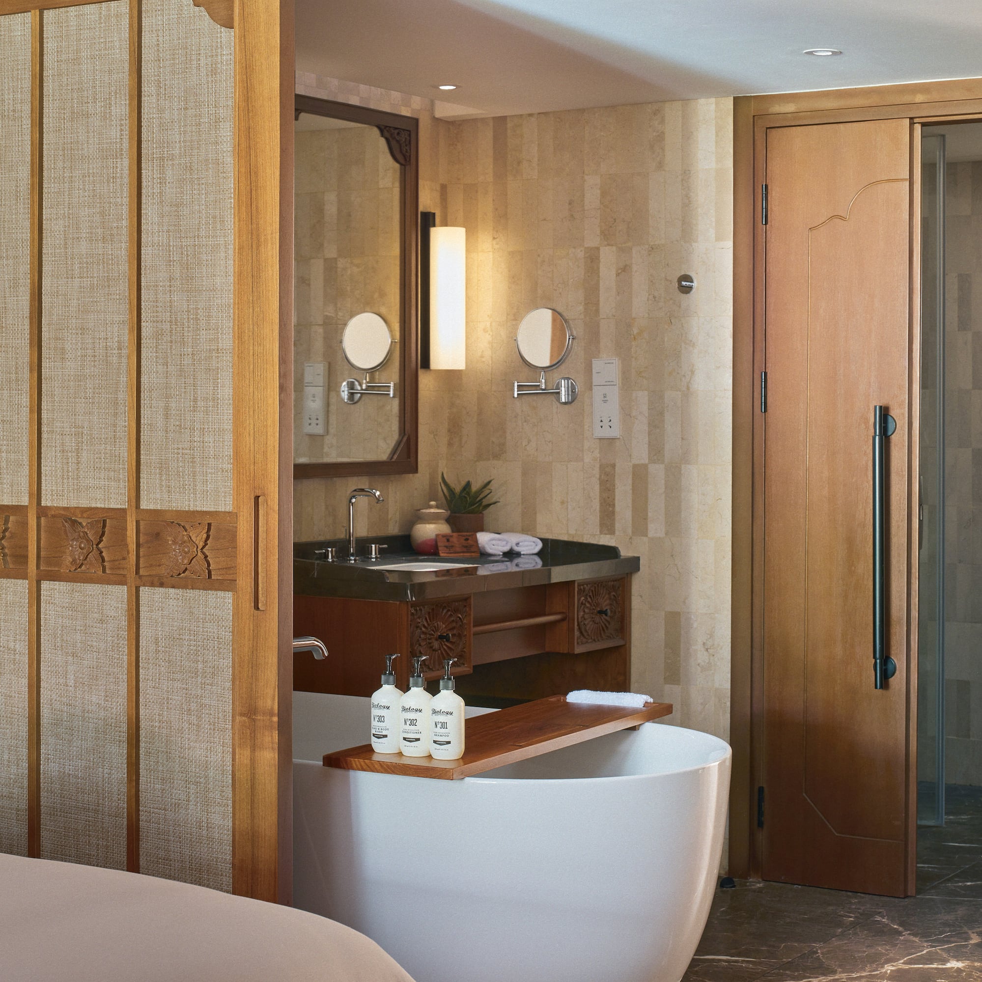 a bathroom with a bathtub and a shower