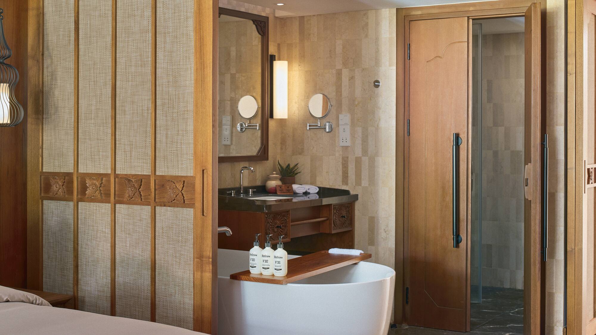 a bathroom with a bathtub and a shower