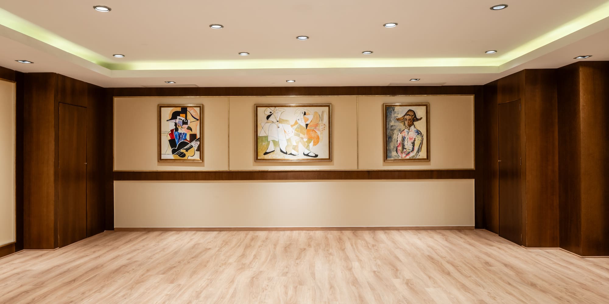 a room with paintings on the wall