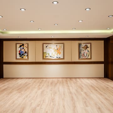 a room with paintings on the wall