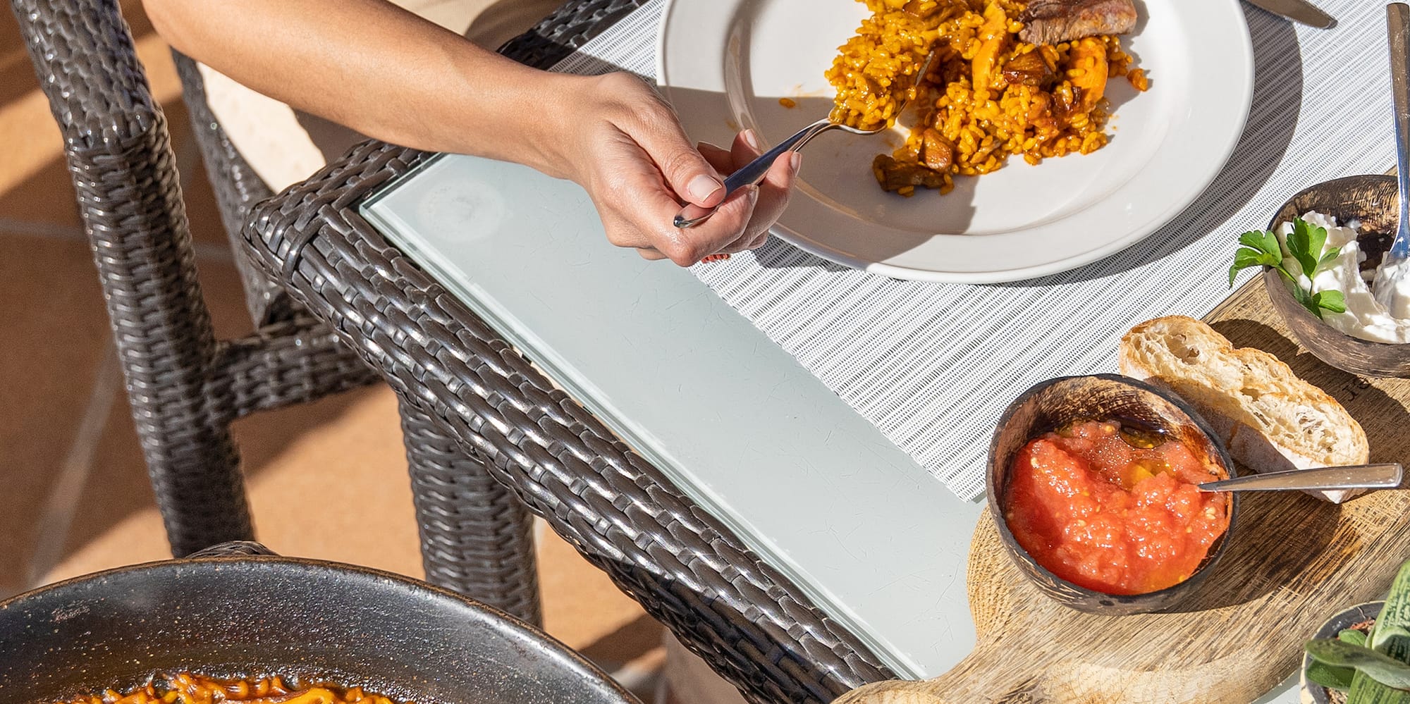 a person eating food on a table