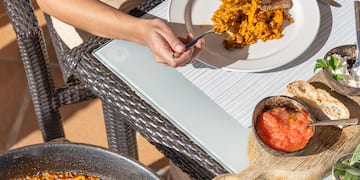a person eating food on a table