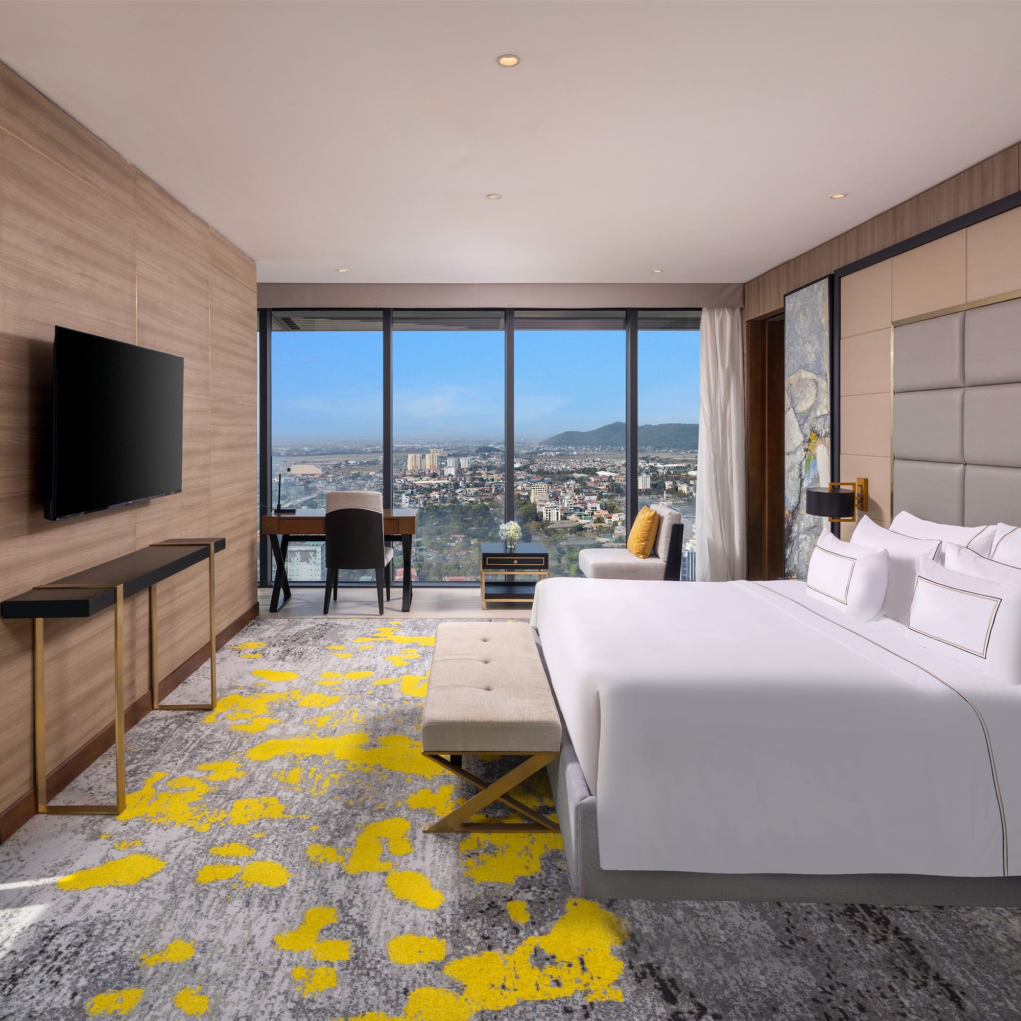 a room with a large window and a bed