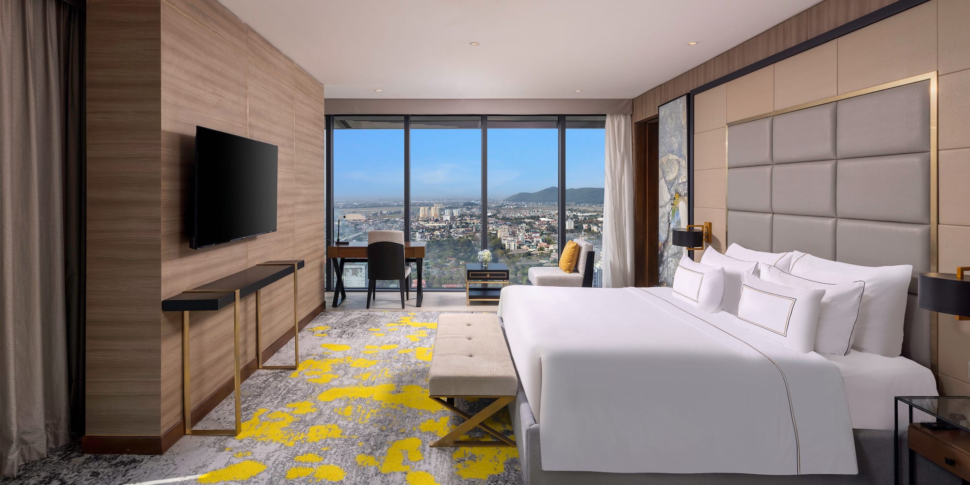 a room with a large window and a bed