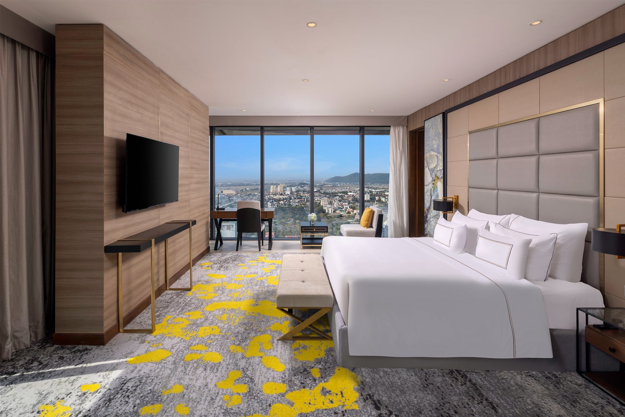 a room with a large window and a bed