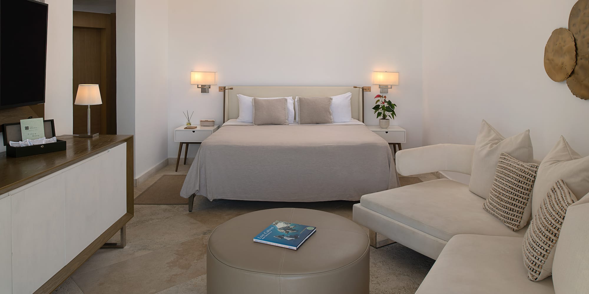 a bedroom with a bed and a couch