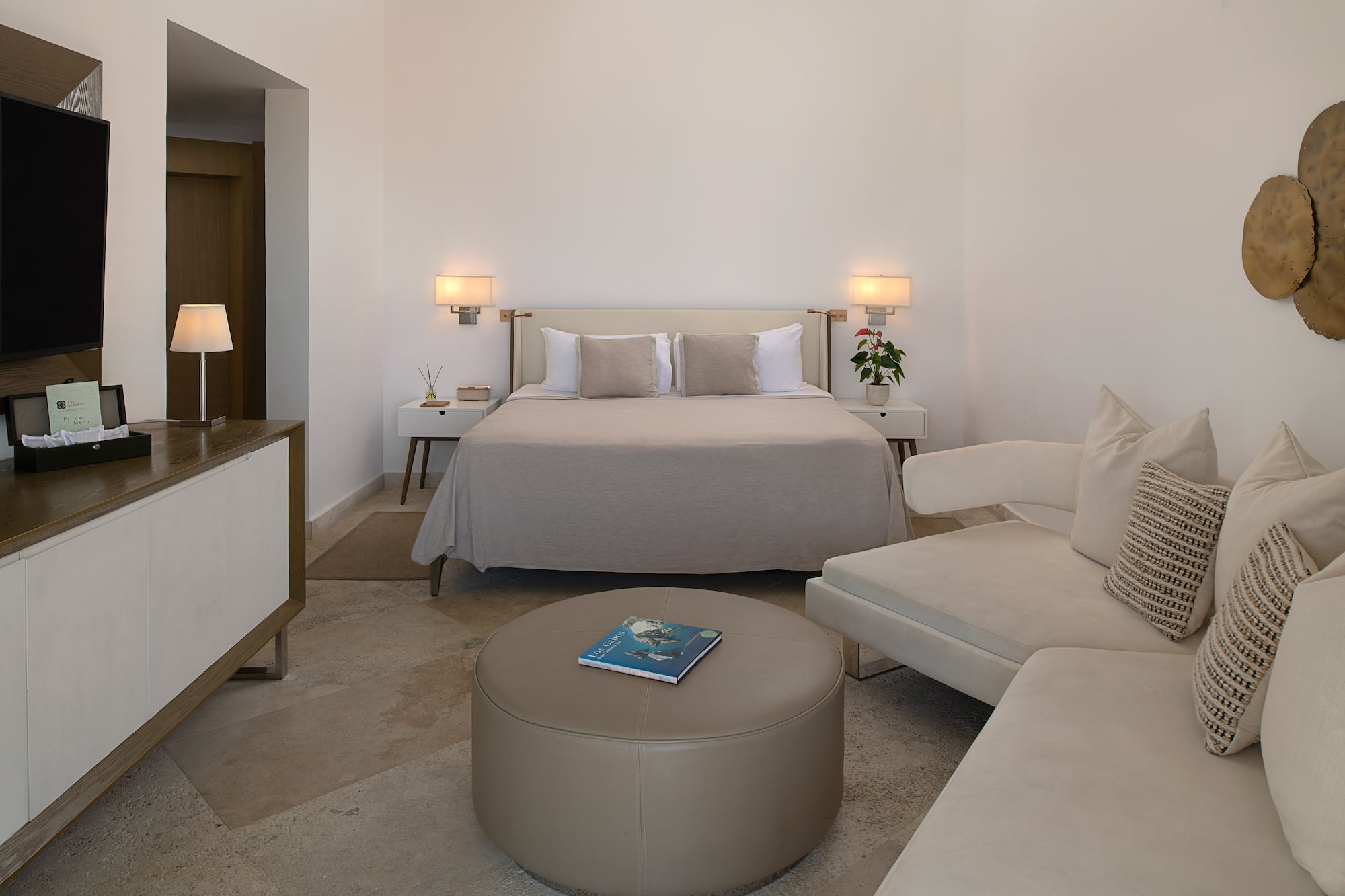 a bedroom with a bed and a couch