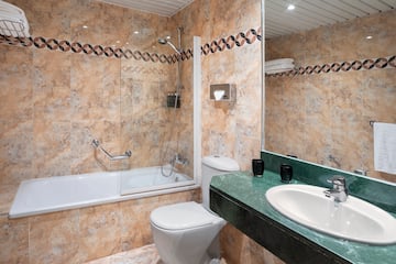 a bathroom with a sink and toilet