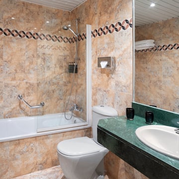 a bathroom with a sink and toilet