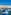 Traditional Maltese luzzu boats in Valletta harbor with historic cityscape.