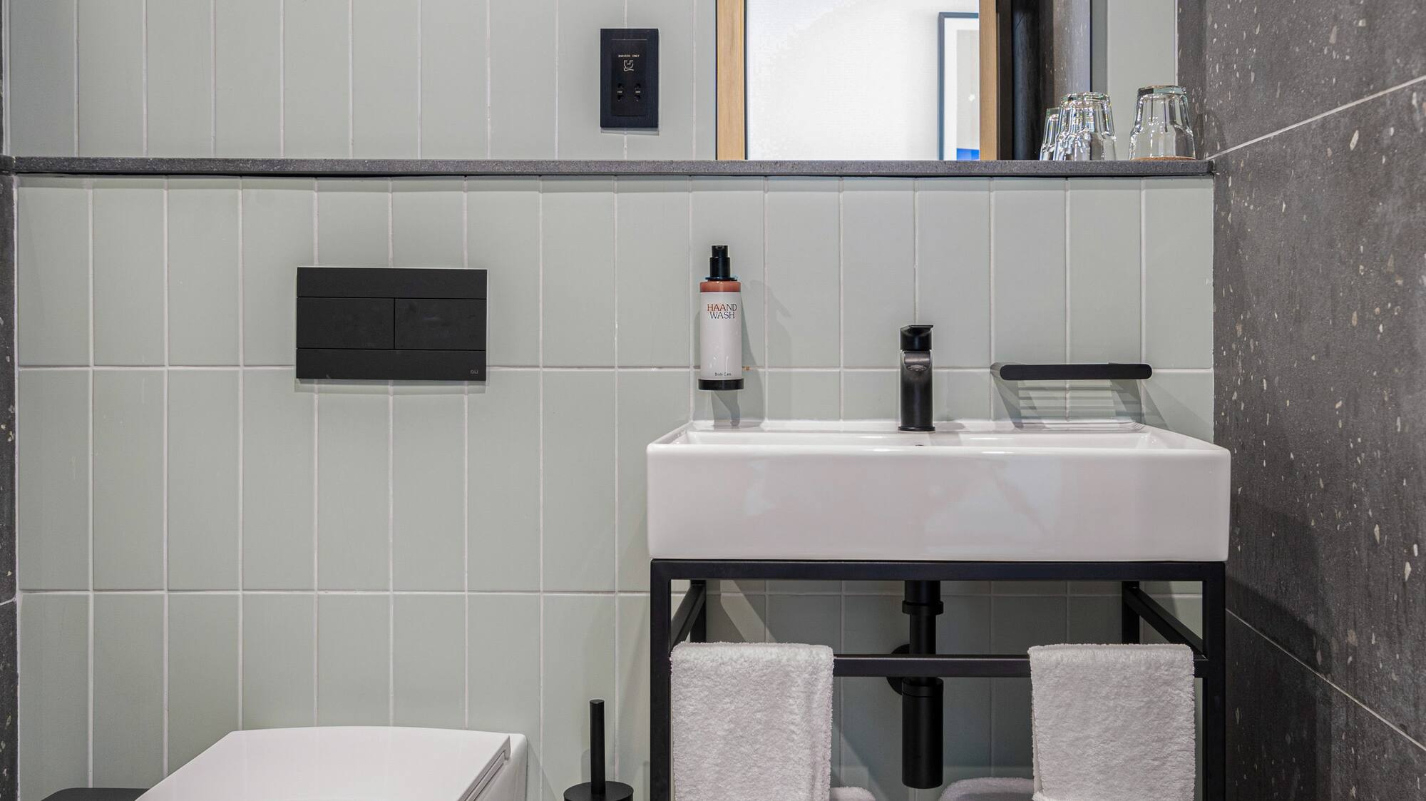 a bathroom with a sink and toilet
