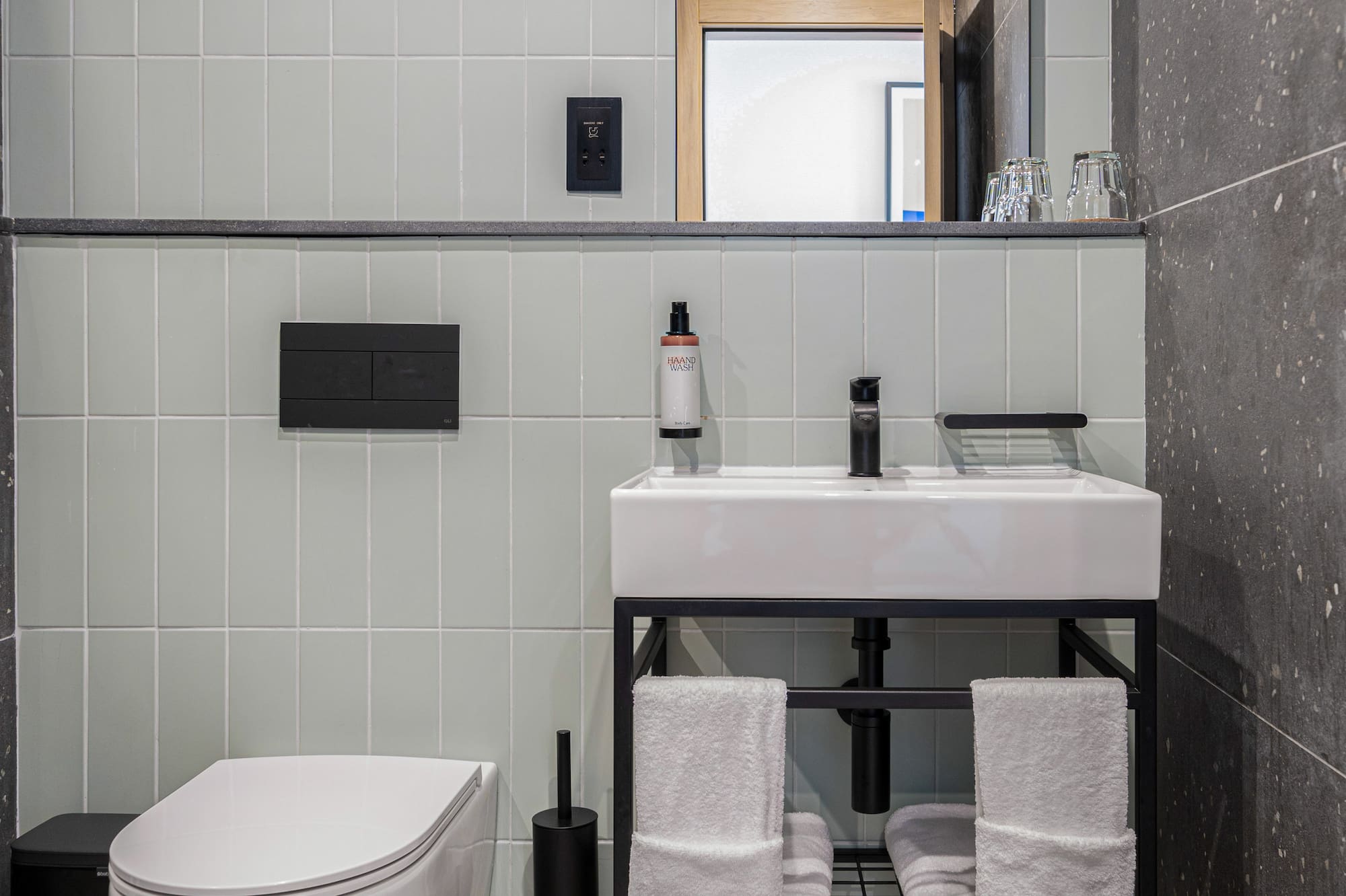 a bathroom with a sink and toilet