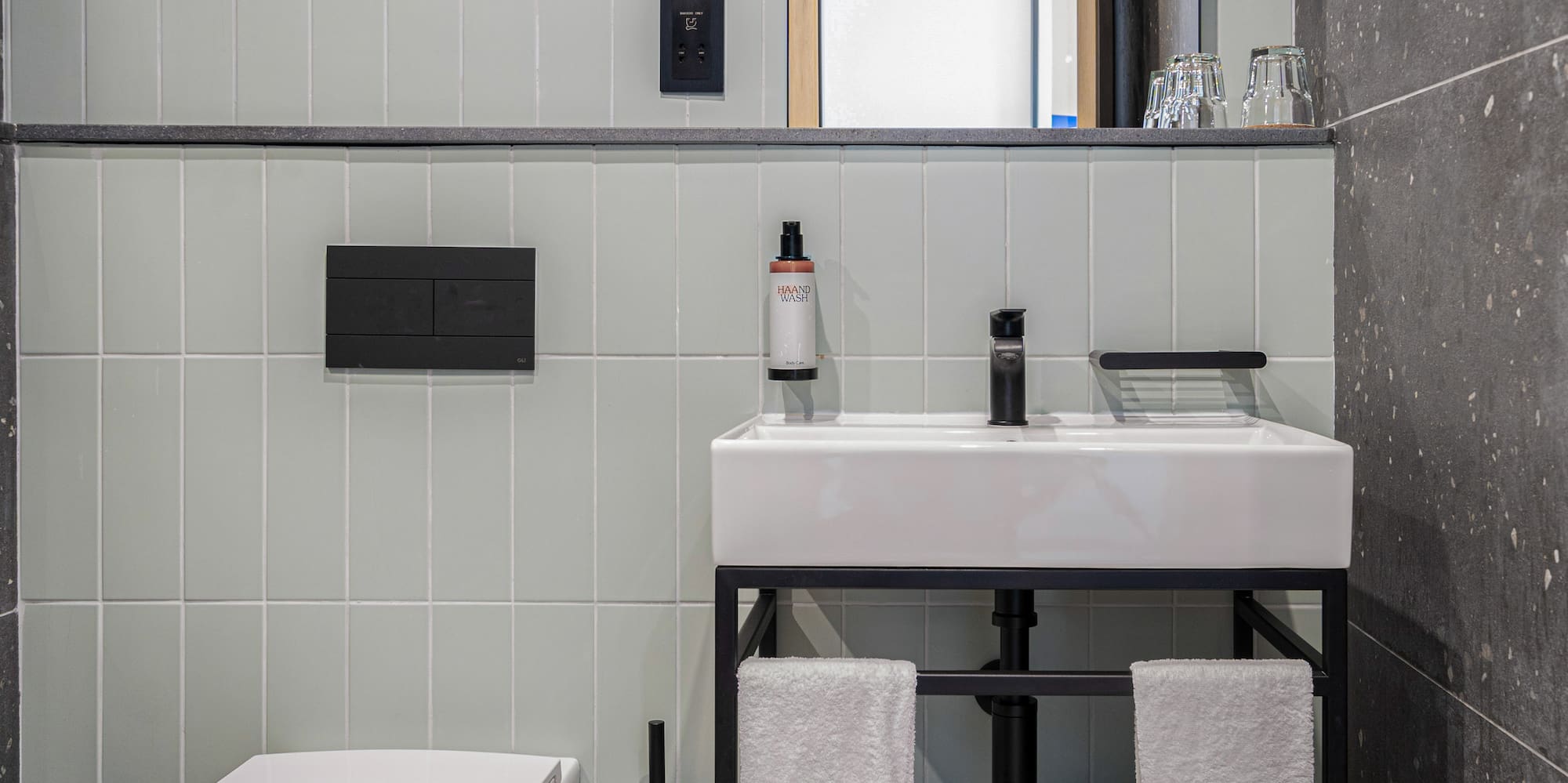 a bathroom with a sink and toilet