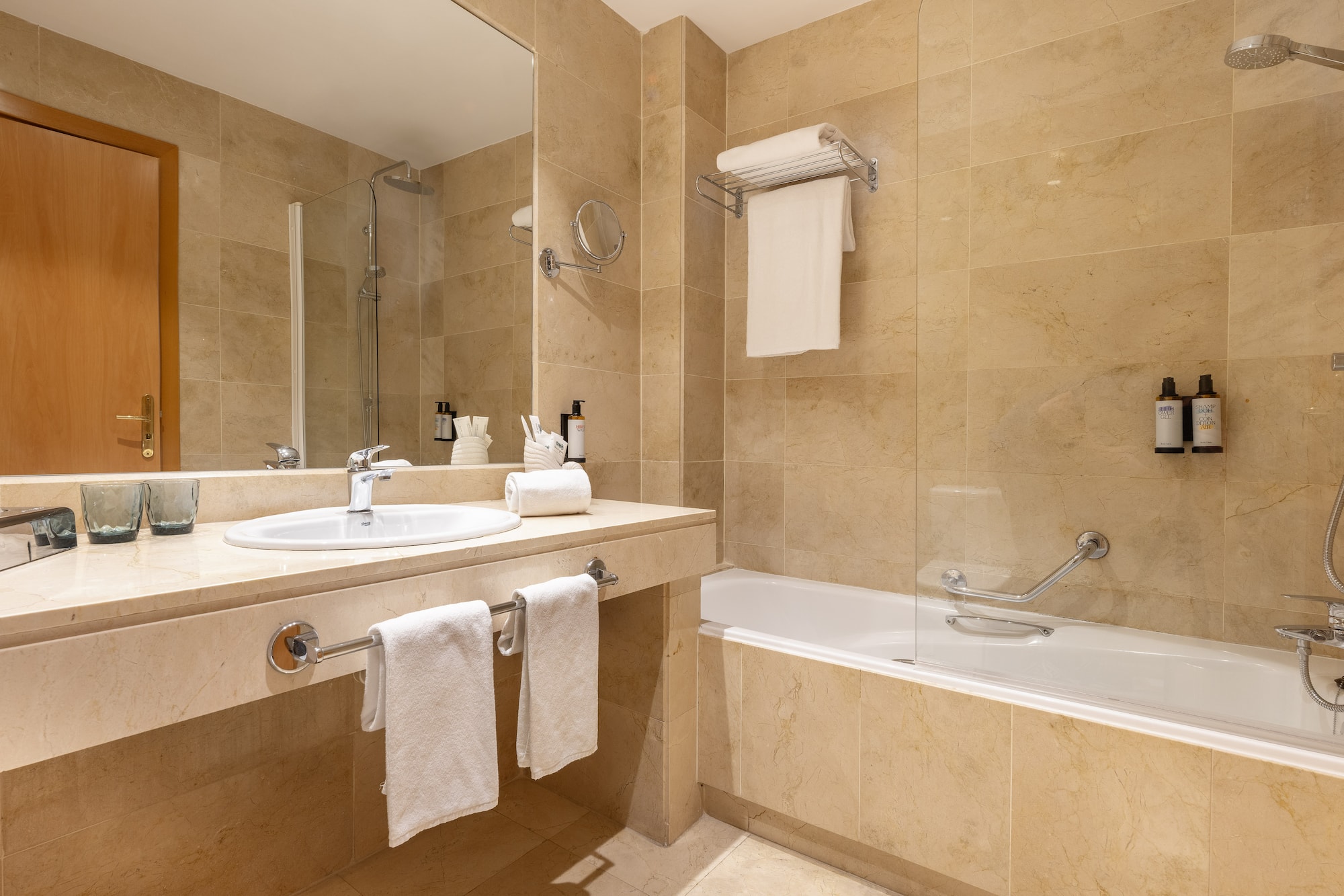 a bathroom with a shower and sink