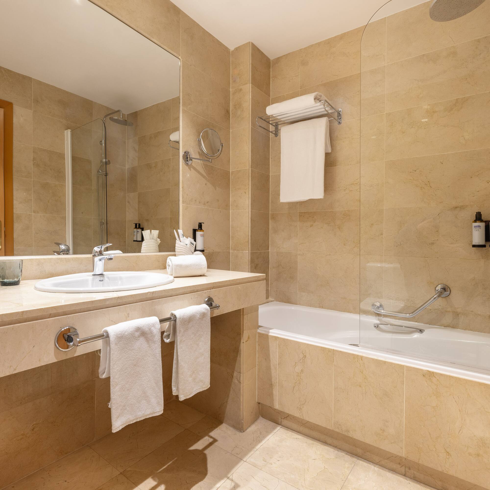 a bathroom with a shower and sink