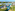 AquaZone tropical resort water park with pools, slides, and hotels.