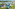 AquaZone tropical resort water park with pools, slides, and hotels.