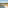 Luxury hotel balcony with a hot tub, ocean view, and lush palm garden.