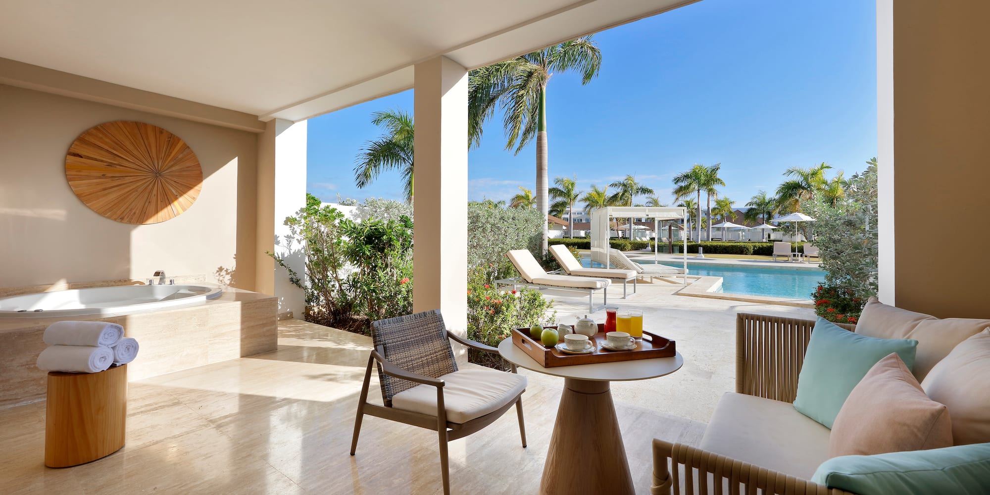 a patio with a hot tub and a table