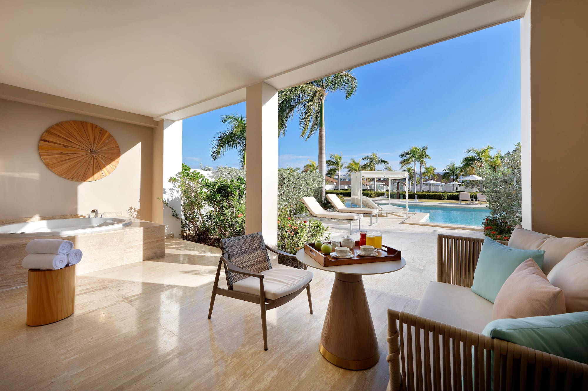 a patio with a hot tub and a table
