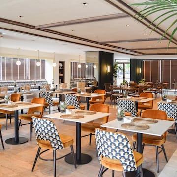 a room with tables and chairs